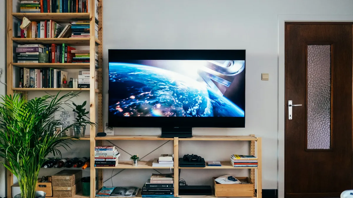 Large 4K TV showing a detailed space scene in a New Zealand living room