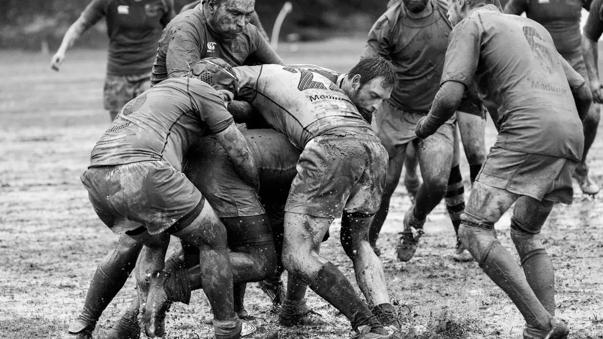 Rugby players in a muddy ruck, the kind of match you can watch with a rugby live stream free in NZ
