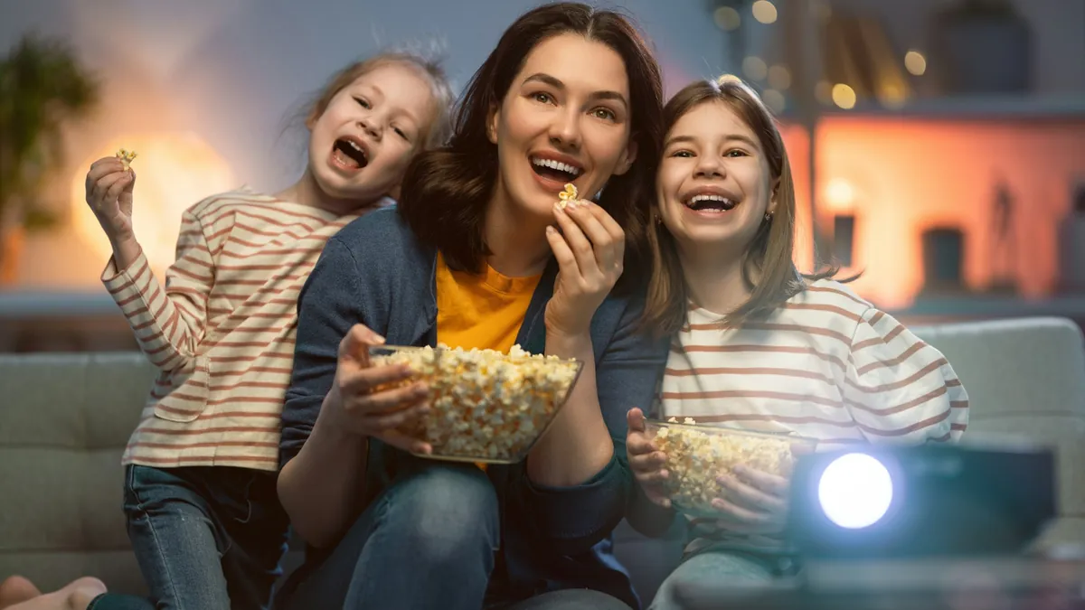 Family watching a film together at home, showing what IPTV looks like in a New Zealand living room