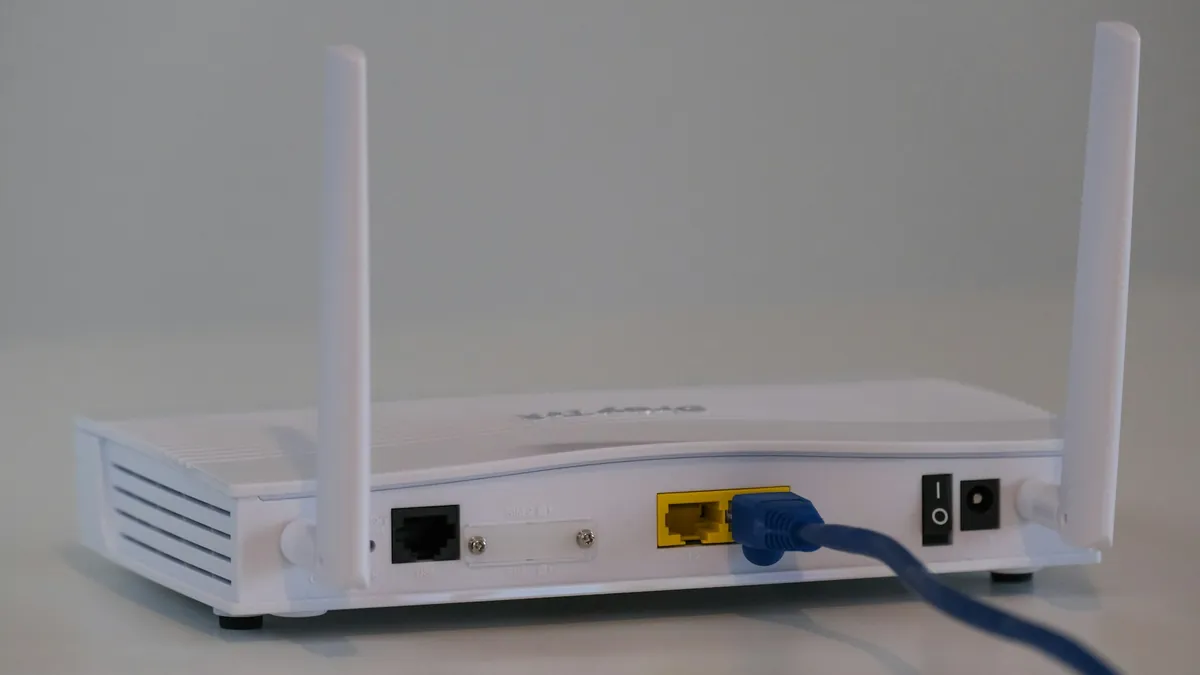 Home broadband router with an Ethernet cable plugged in, the most effective fix for IPTV buffering